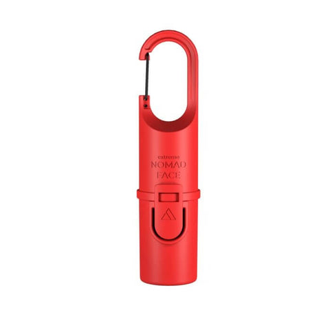 Protector solar Nomad Face Stick SPF50+ color rojo, perfecto para actividades al aire libre.
