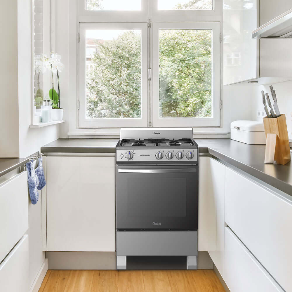 Cocina a gas 24 pulgadas Midea con 4 quemadores de hierro fundido en cocina moderna,